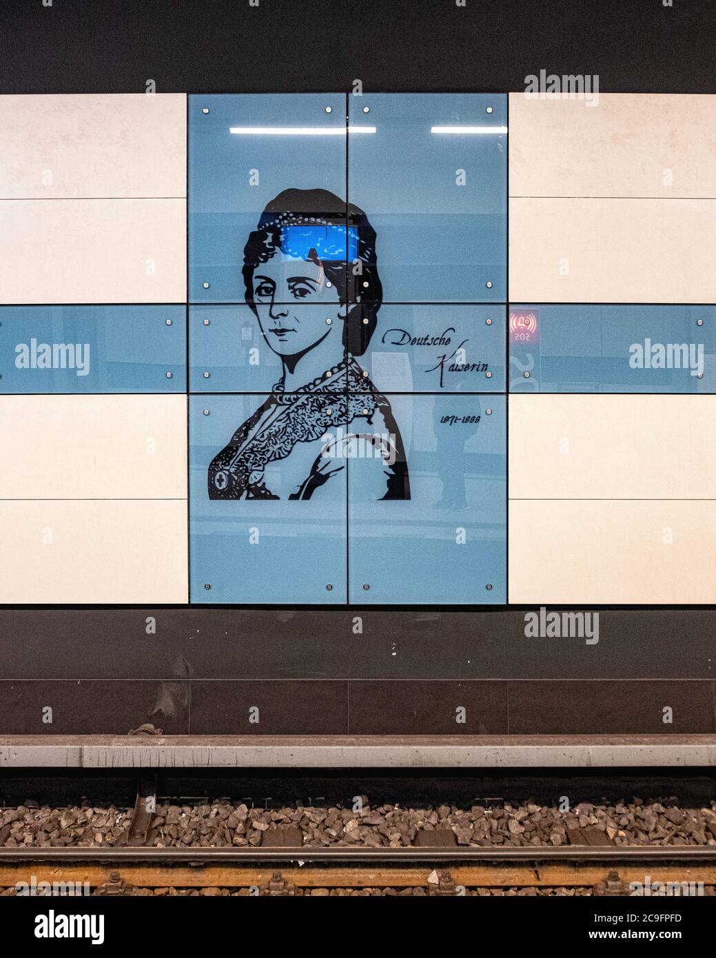 The Kaiserin-Augusta-Strasse U-Bahn underground railway station interior onU6 line in Tempelhof-Berlin.Blue & white tiled wall monochrome  portrait. Stock Photo