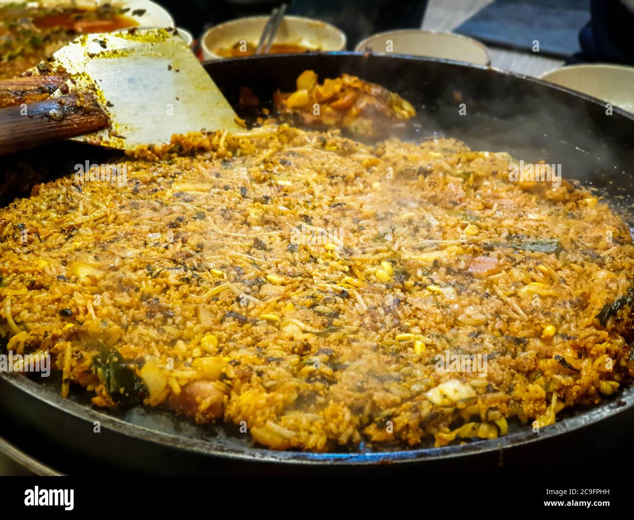 Fried Rice after Cheese Dak-galbi, spicy stir-fried chicken rib, vegetable, noodle and cheese on grill - South Korea. Popular Korean food. Stock Photo