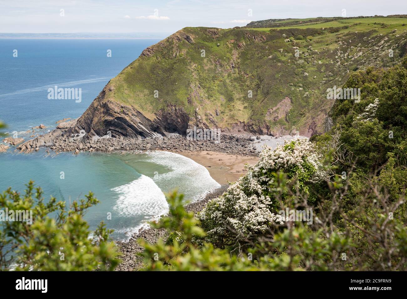 Shipload Bay on Devon's coast with waves rolling in Stock Photo