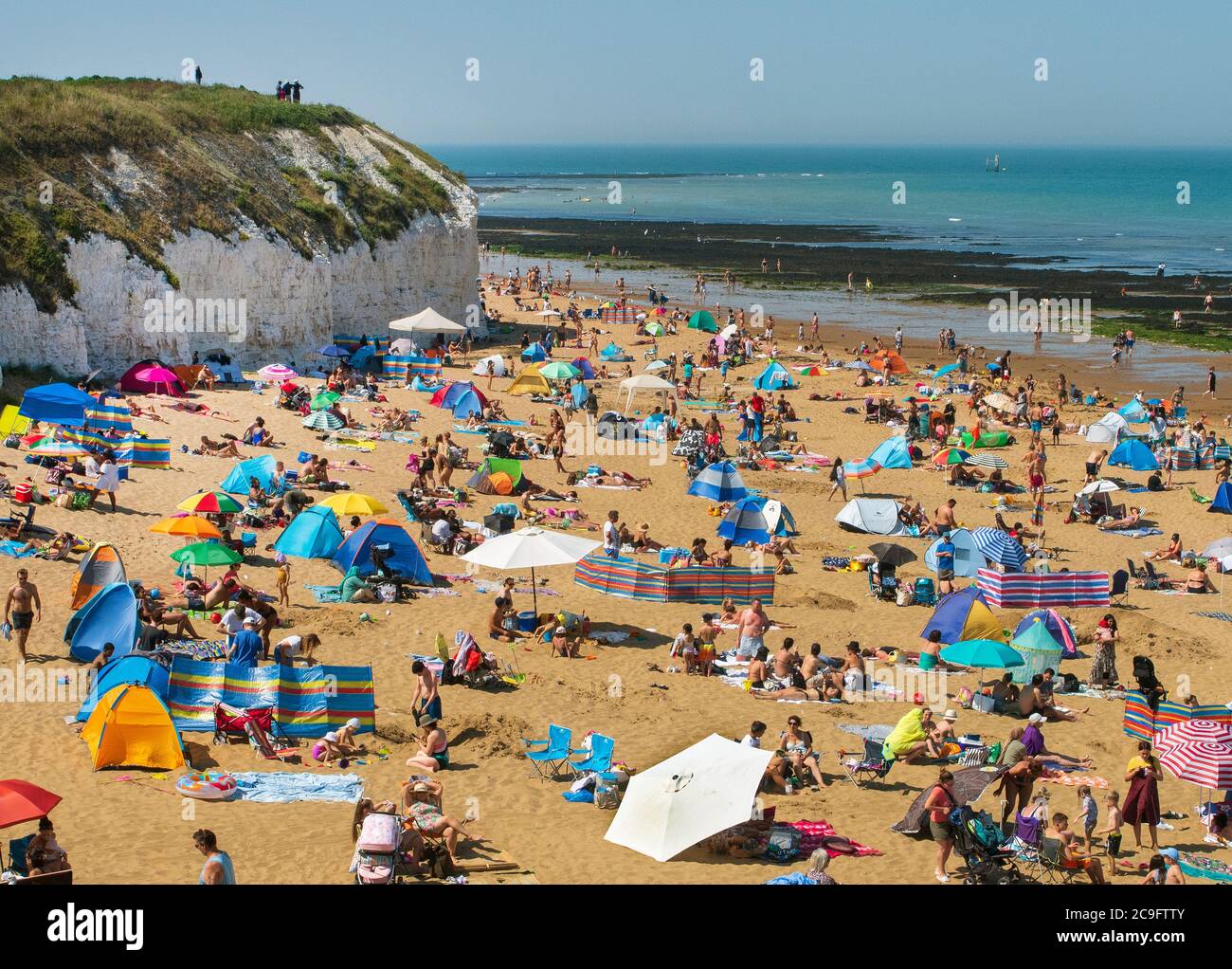 Joss Bay Broadstairs Thanet Kent UK. Holiday makers making most og very hot day on their staycation. Stock Photo