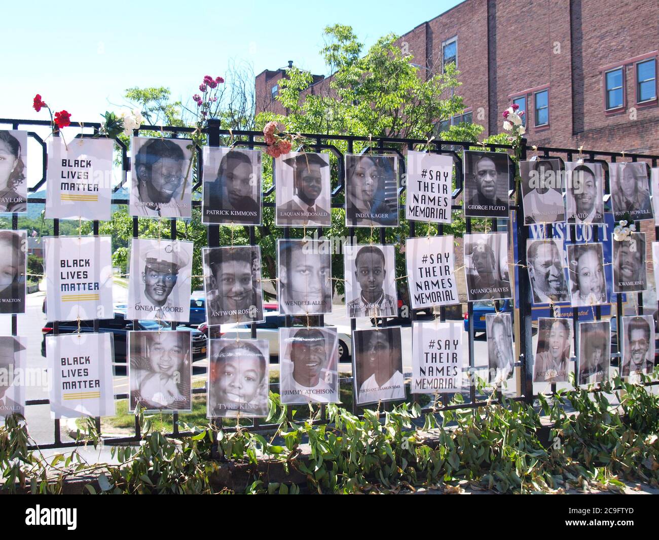 Oneonta, NY / USA - July 31, 2020: Display of photographs and names of black victims of white perpetrators comprise the BLM 'Say Their Names' memorial Stock Photo