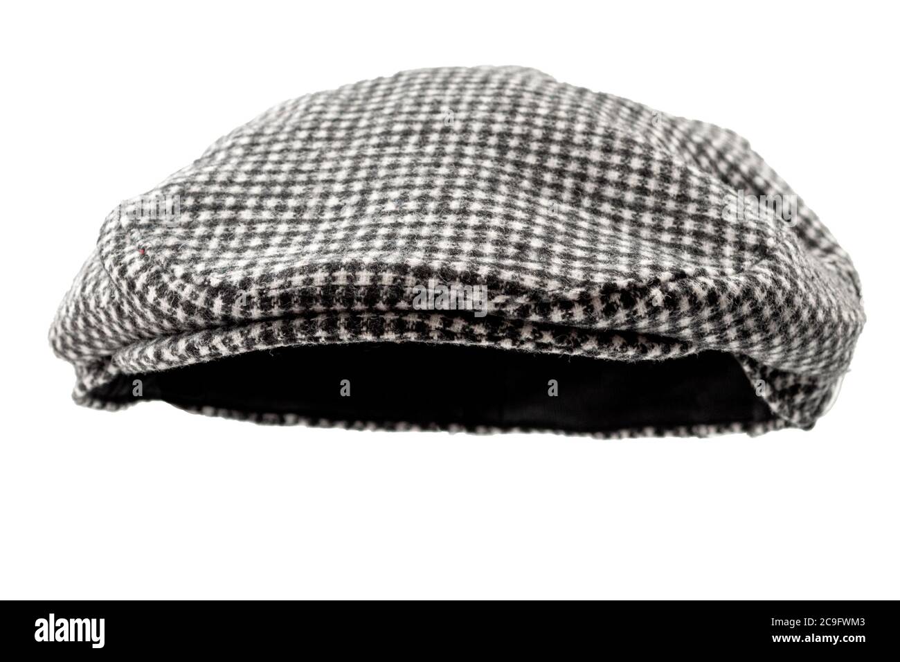Floating grey hunting tweed flat cap or newsboy cap isolated on white background with clipping path cutout using ghost mannequin technique Stock Photo