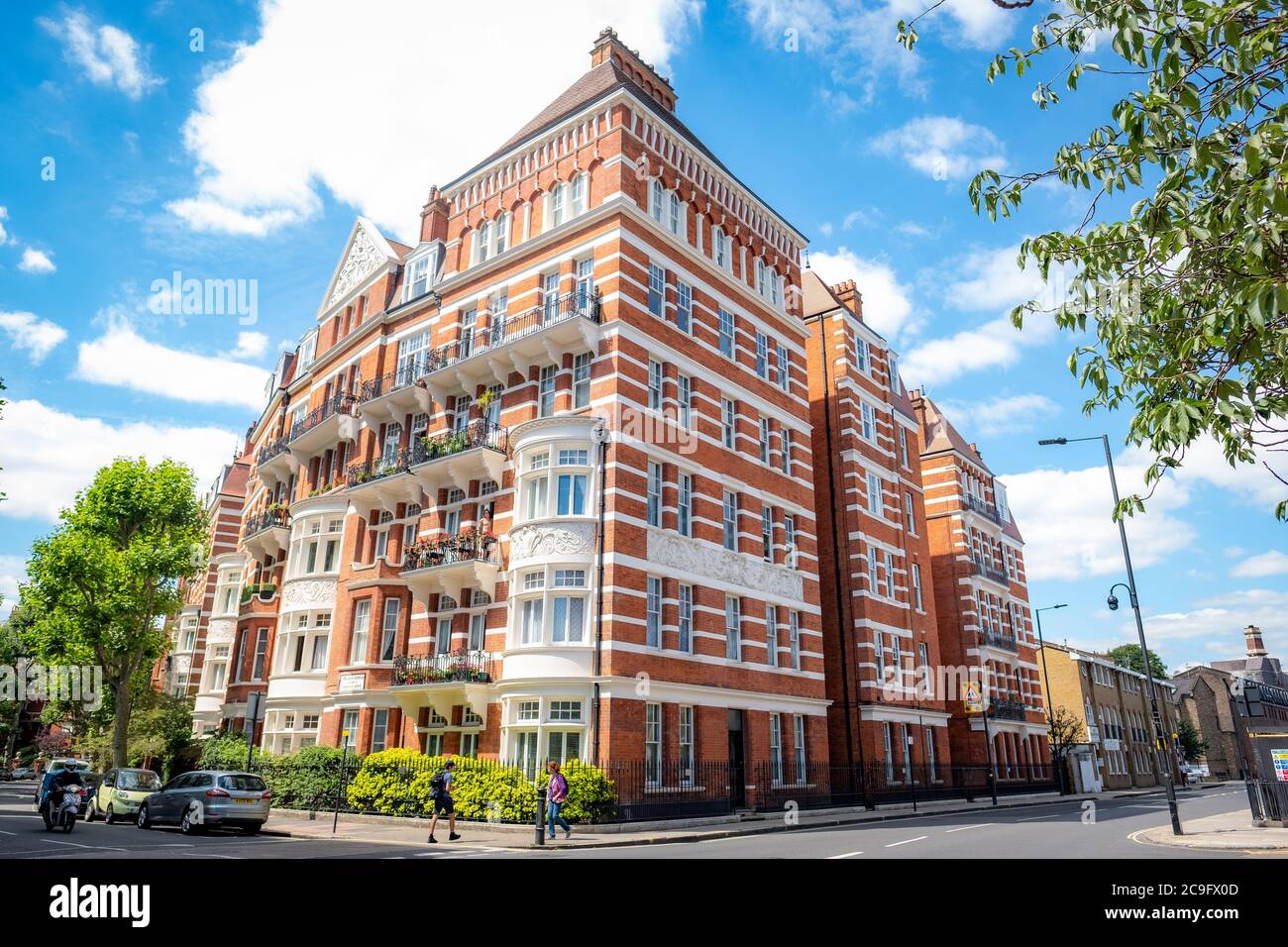 London- July, 2020: Typical red brick mansion building on North End Road in West Kensington Stock Photo