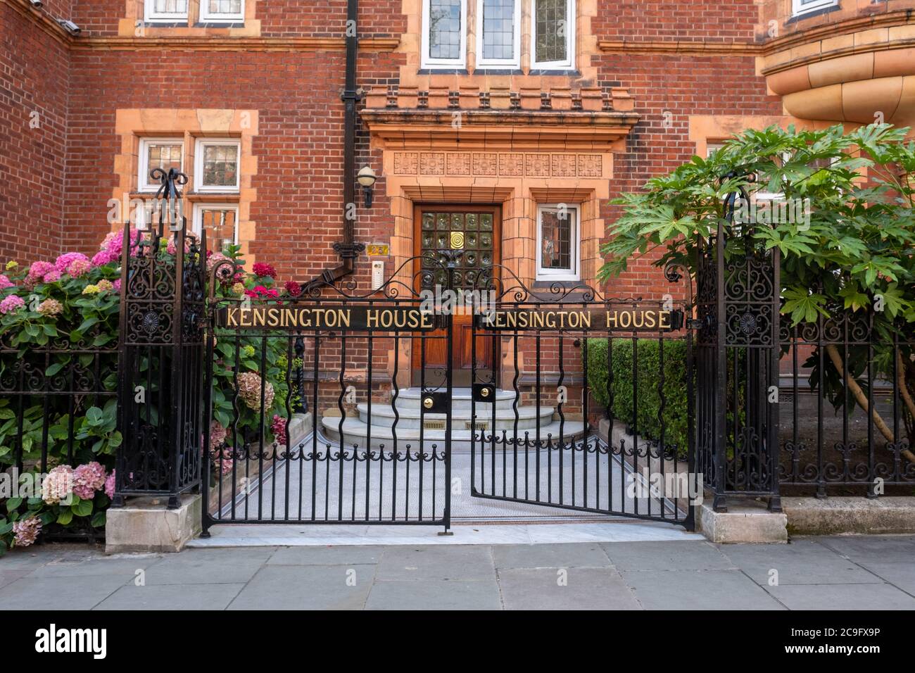 London- July, 2020: Kensington House, a typical block of attractive red brick apartments in west London Stock Photo
