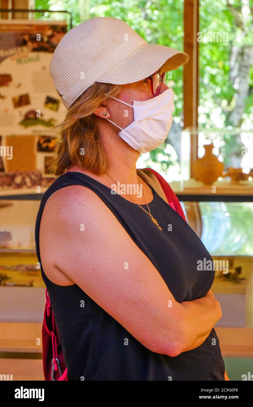Female tourist wearing a protective face mask, Saint-Père, Yonne,  Bourgogne-Franche-Comté region, France Stock Photo