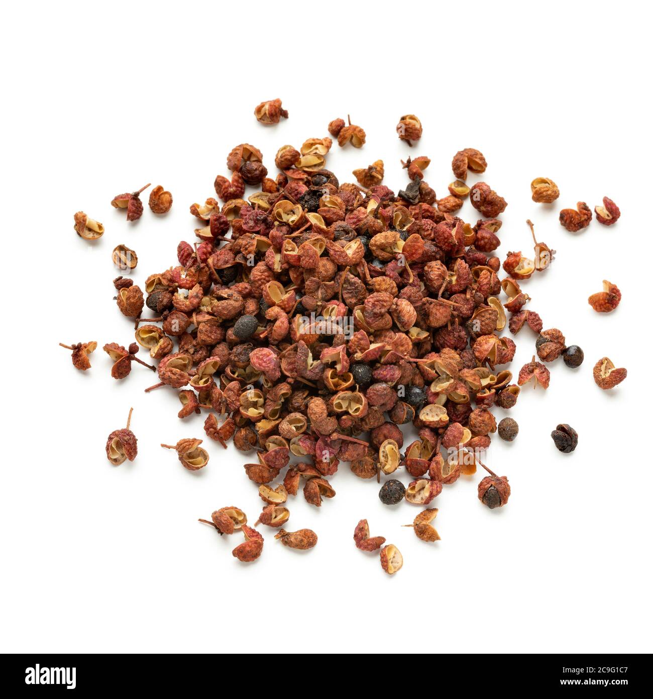 Heap of dried Sichuan pepper seeds isolated on white background Stock Photo