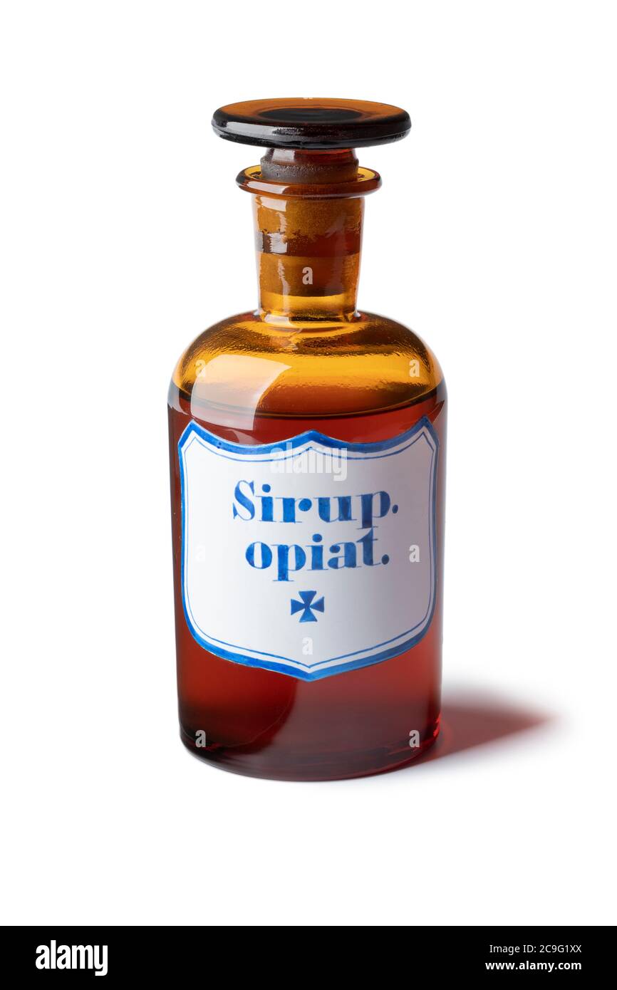 Historic old pharmacy bottle with opium syrup isolated on white background Stock Photo