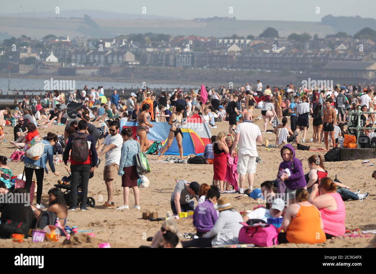 People enjoying the weather on Portobello Beach in Edinburgh Stock