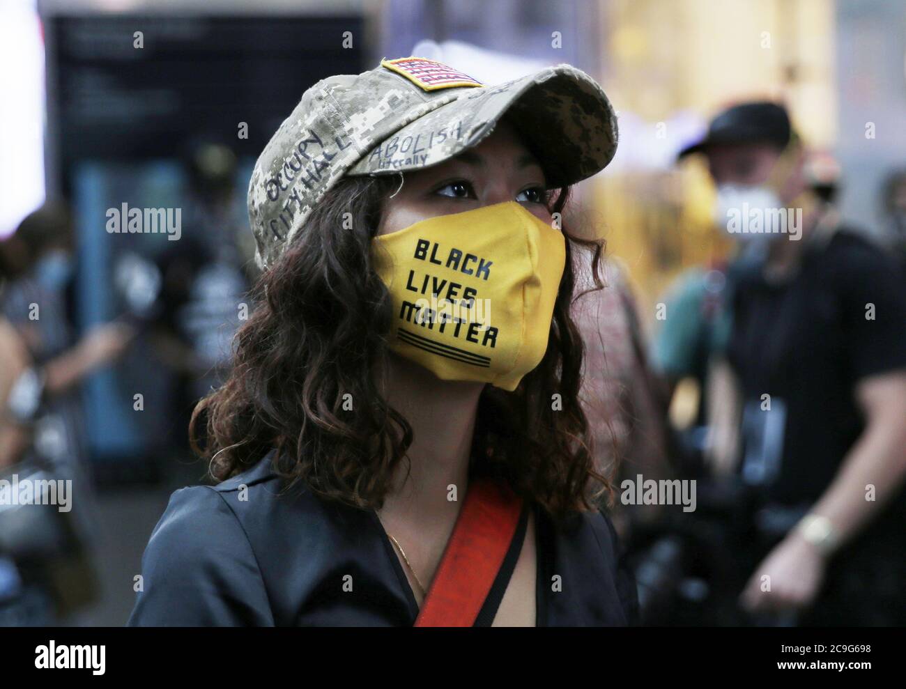 New York, United States. 31st July, 2020. People gather in Times Square for the 'Take Your Knee Off Our Necks March' in New York City on Friday, July 31, 2020. The 'Take Your Knee Off Our Necks March' is a protest of police brutality, black on black crime, institutionalized racism, discrimination, immigration, education equality, and youth resources. Photo by John Angelillo/UPI Credit: UPI/Alamy Live News Stock Photo