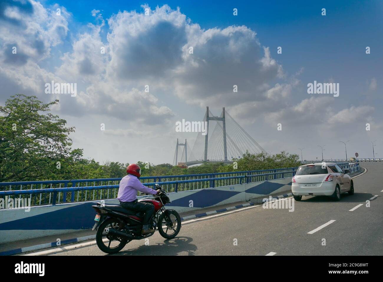 Kolkata, West Bengal, India - 23rd May 2020 : Blue sky with white clouds over 2nd Hoogly Bridge, connecting Howrah and Kolkata. Stock Photo