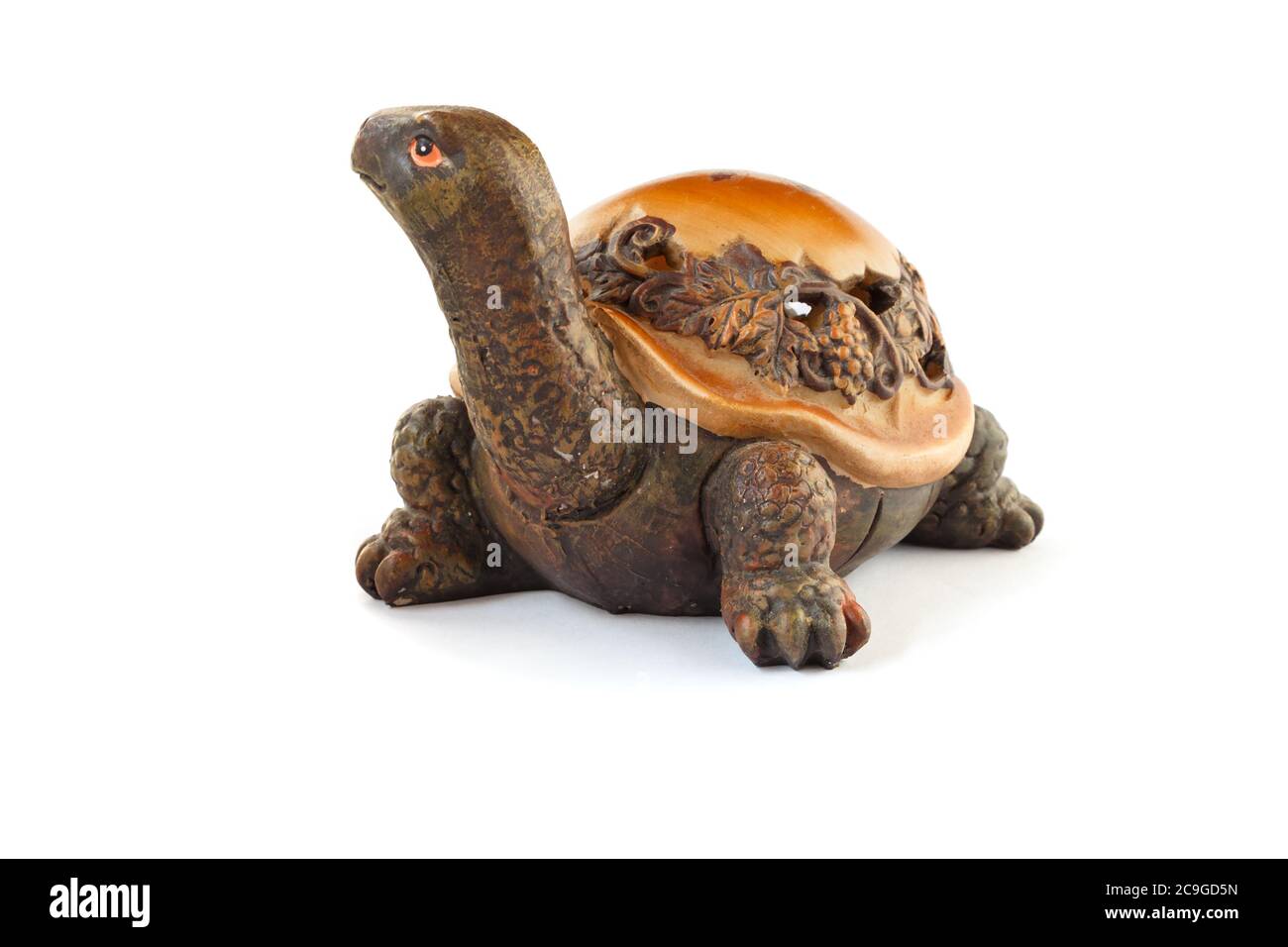 Wooden turtle figurine isolated on white background. Stock Photo