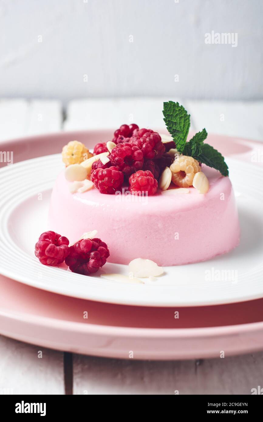 Pink Pudding With Raspberry Pink panna cotta dessert with fresh raspberries Stock Photo - Alamy
