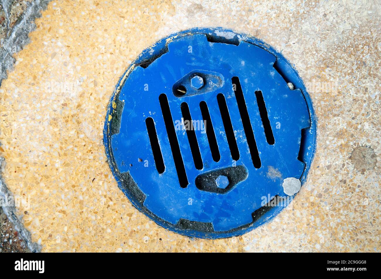 A bright blue water drain Stock Photo Alamy