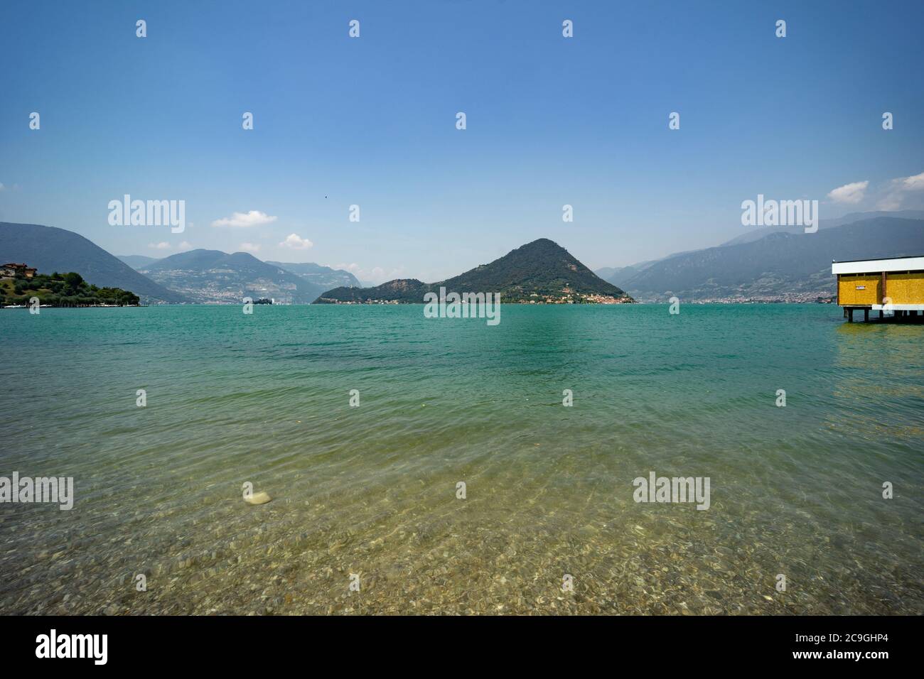 The Montisola island in the middle of Lake Iseo, Val Camonica, Lombardy, Italy, panoramic view from the shoreline Stock Photo