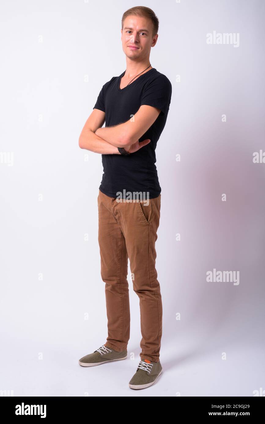 Portrait of handsome man against white background Stock Photo - Alamy