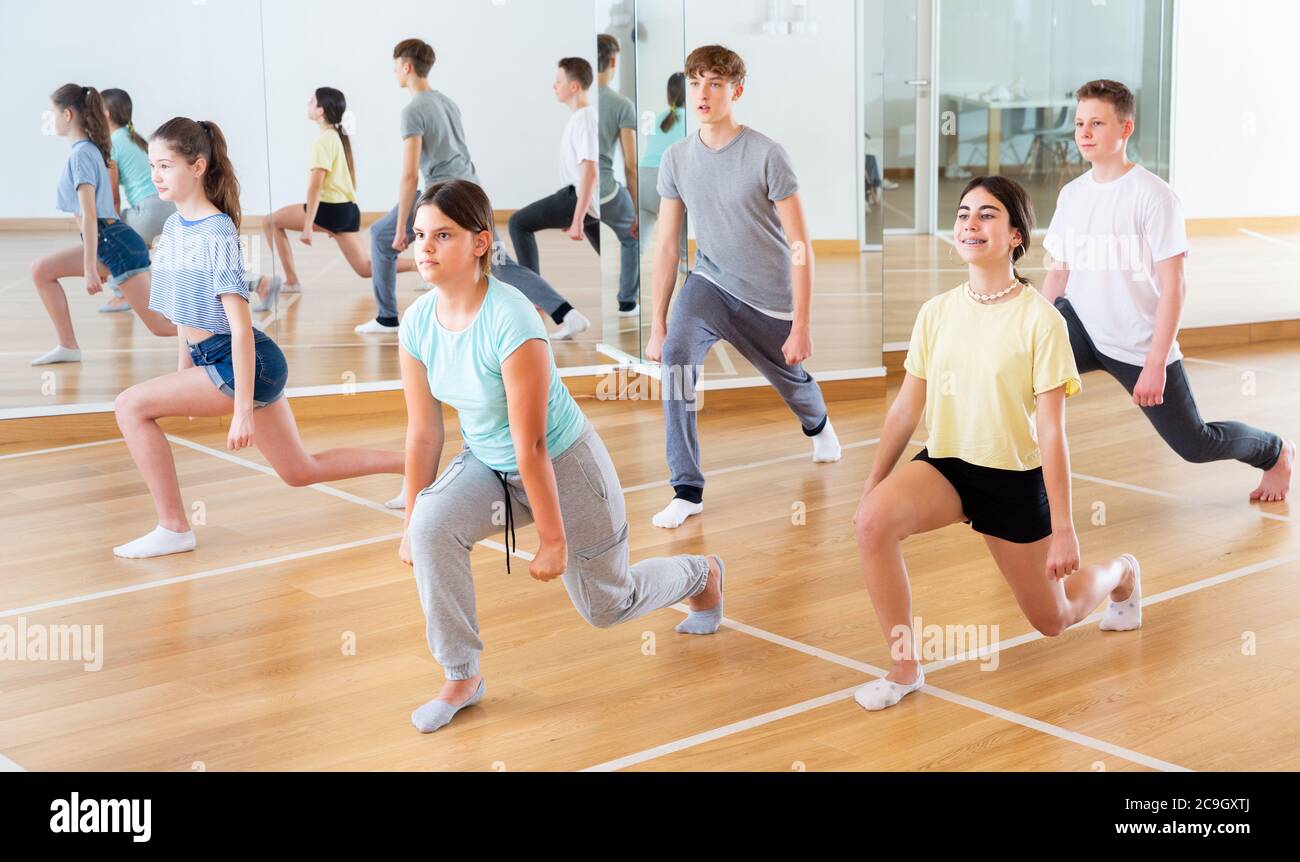 Active teens learn new dance moves in dance studio Stock Photo Alamy
