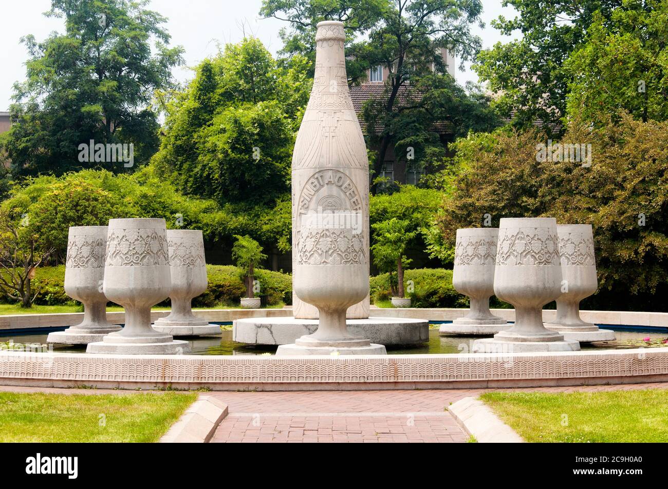 Qingdao, China.  June 26, 2016.  A bottle and drinking glasses Tsing Tao beer statues within the Tsing Tao Beer Museum in Qingdao China, shandong prov Stock Photo