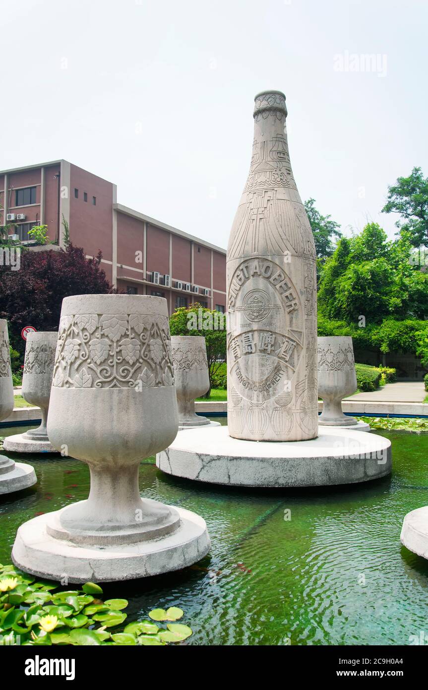 Qingdao, China.  June 26, 2016.  A bottle and drinking glasses Tsing Tao beer statues within the Tsing Tao Beer Museum in Qingdao China, shandong prov Stock Photo