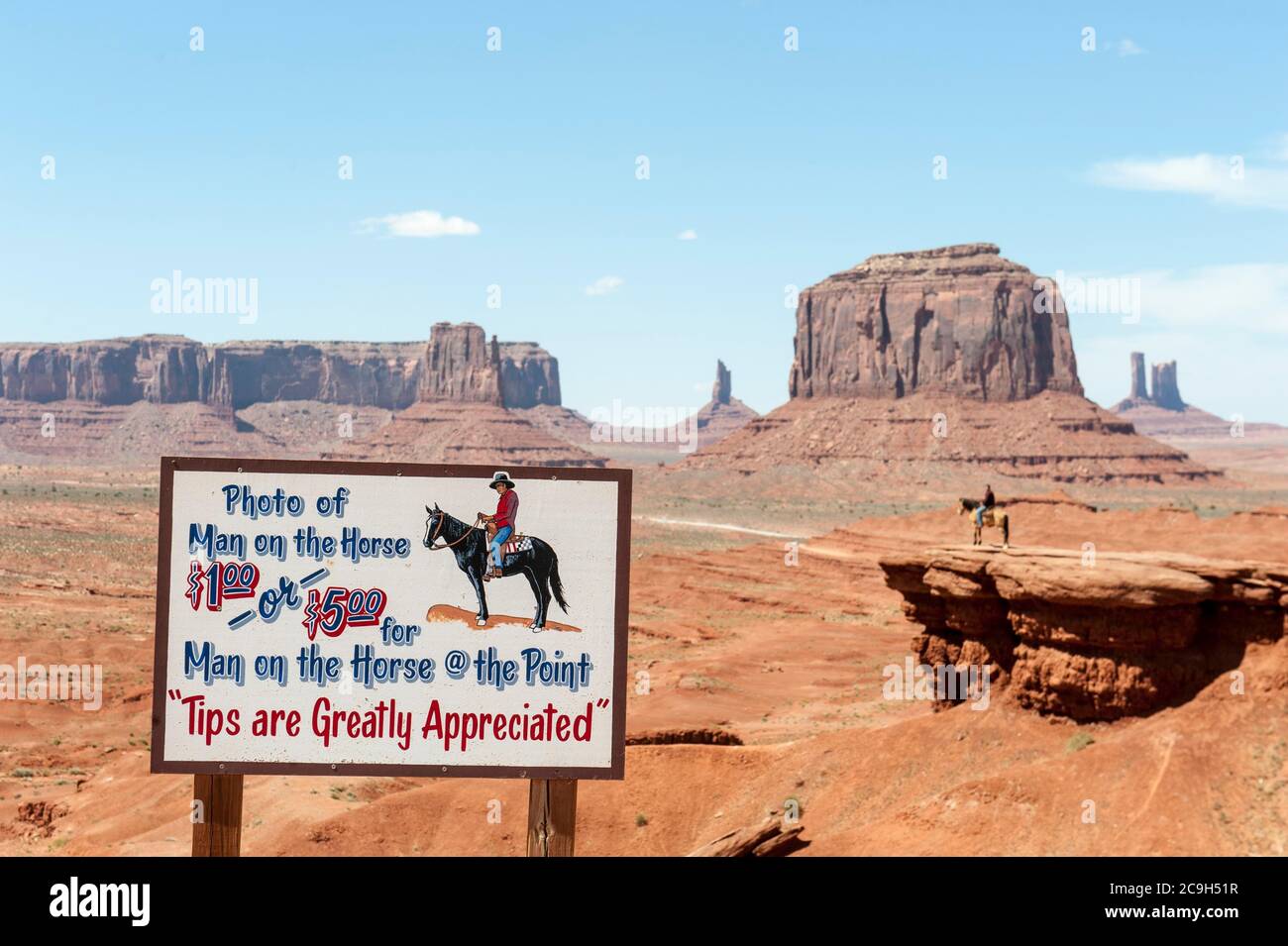 Commercialization, tourism, sign Photo of man on the horse, man on horse, geology, erosion landscape, table mountains, John Ford's Point, Monument Stock Photo