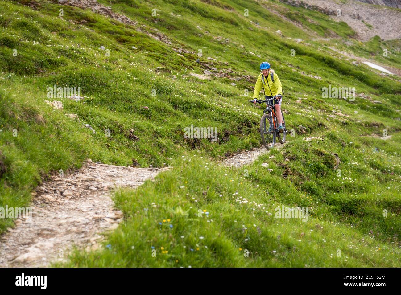 Mountain biker rides on Singeltrail, difficulty level S1, Serfaus, Tyrol, Austria Stock Photo