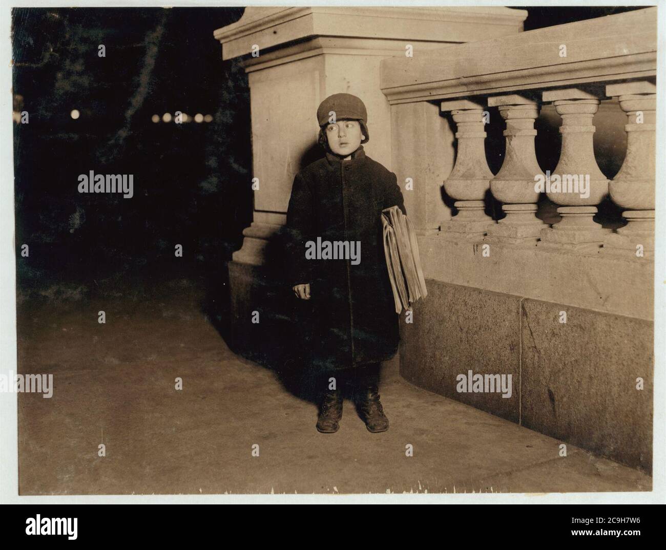 Izzie Kline, 8 yrs. old, Newsboy. Sells until 7 P.M. some nights. Taken at 6 P.M. Stock Photo