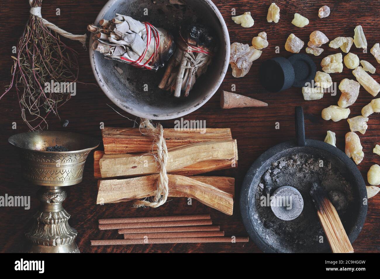 Flat lay various air element objects to use in witchcraft wicca on witch's altar filled with sage smudge sticks incense, Palo Santo tree, frankincense Stock Photo