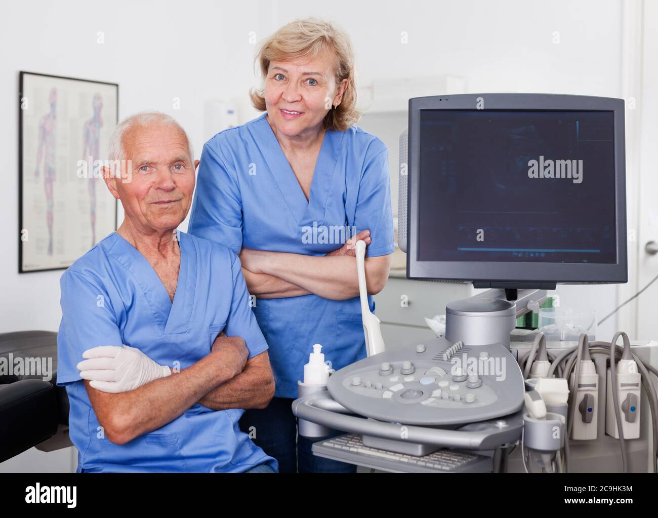 Portrait of qualified male and female doctors near modern ultrasound ...