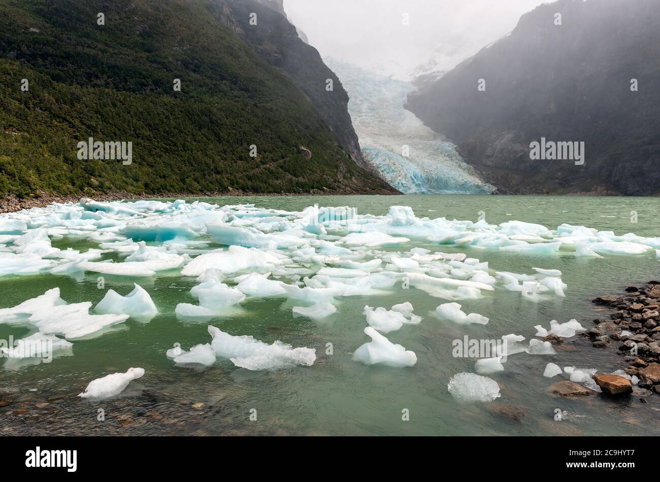 The receding Serrano Glacier in the mist losing ice due to climate change, Bernardo O´Higgins National Park, Patagonia, Chile. Stock Photo