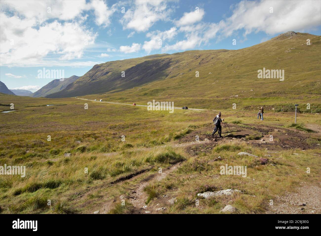 Tourists walking in the Scottish Highlands, Glencoe, Scotland, UK Stock Photo