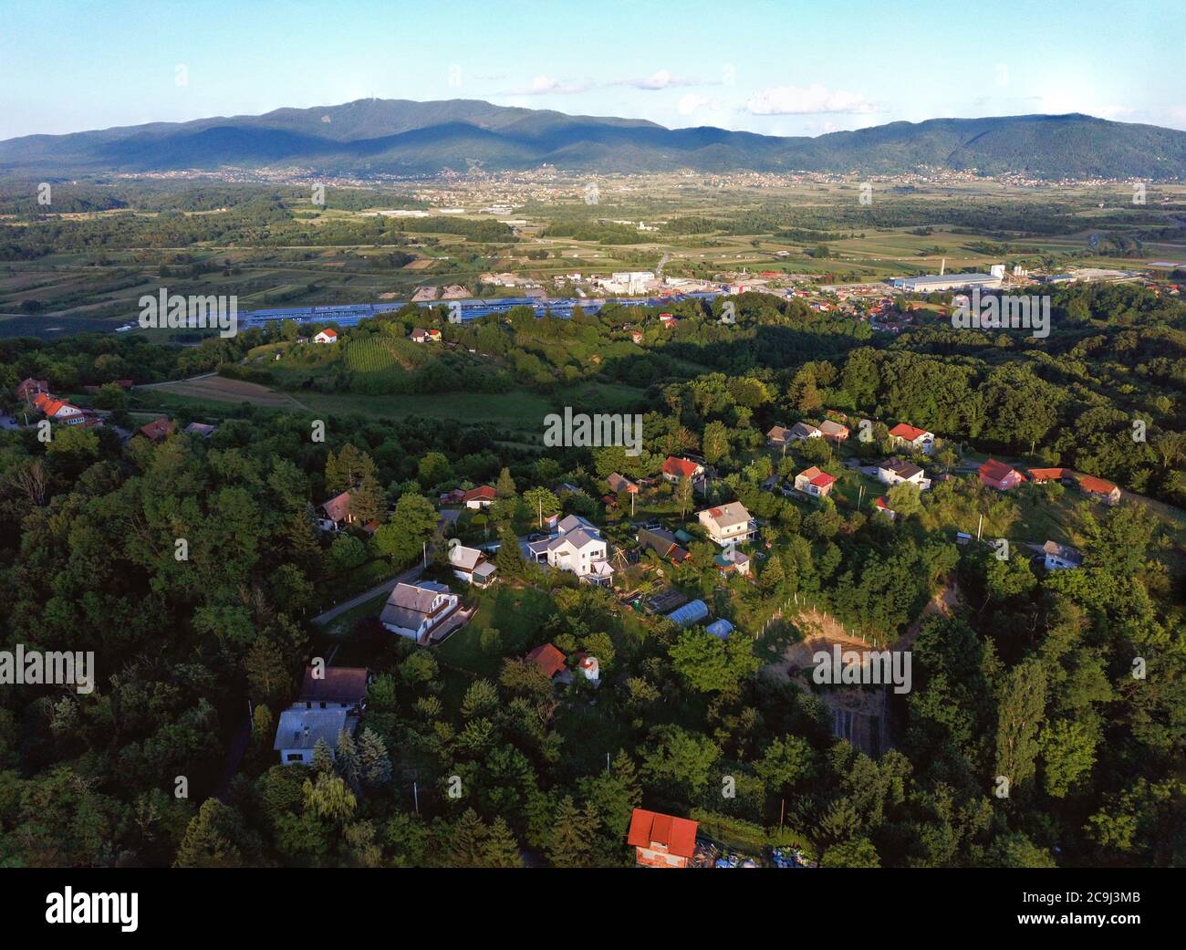 Aerial view of beautiful rural landscape in Pusca, small village in Croatian Zagorje, near town of Zapresic, with Medvednica mountain in background Stock Photo