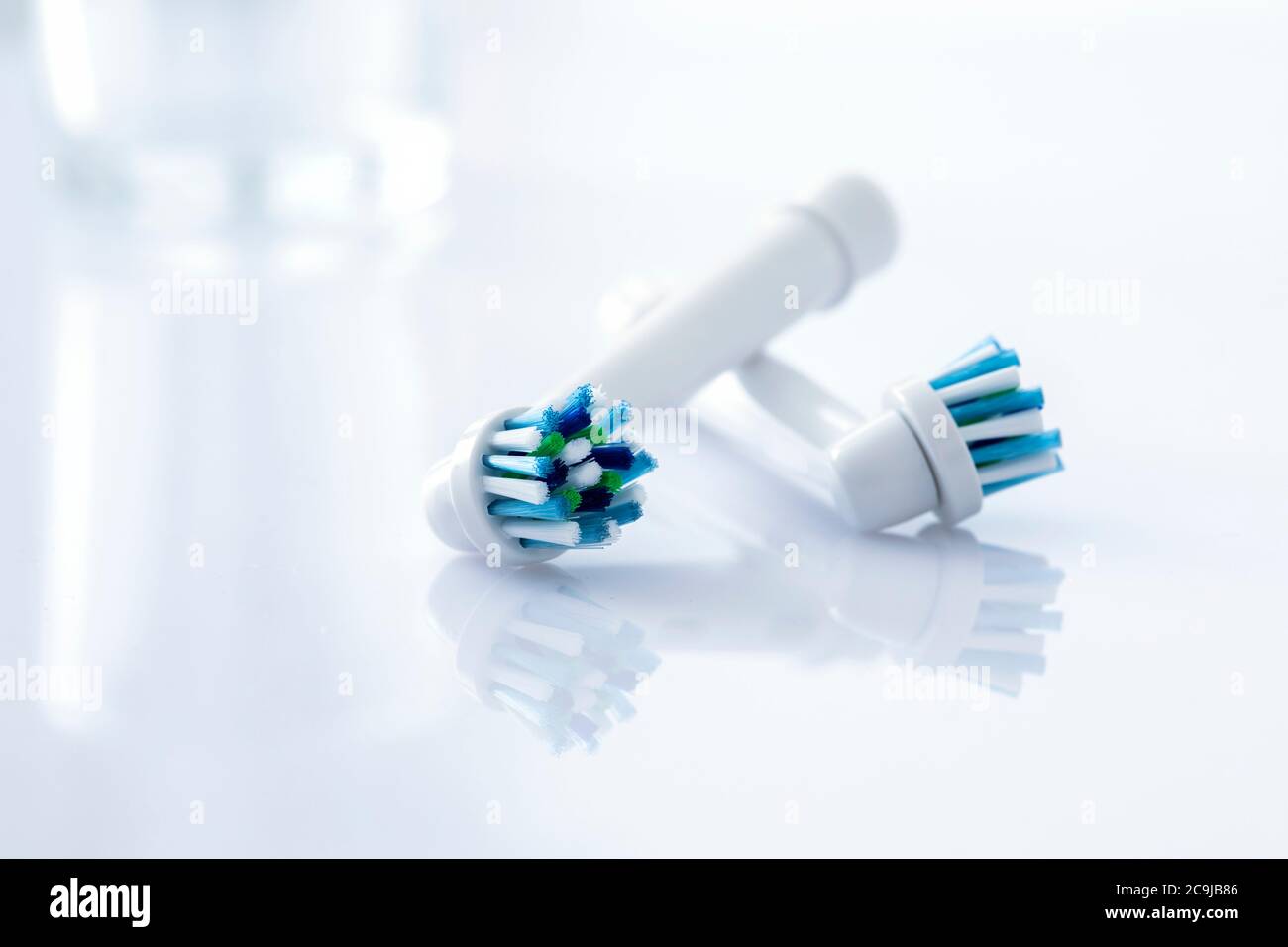 Electric toothbrush heads against a white background Stock Photo - Alamy