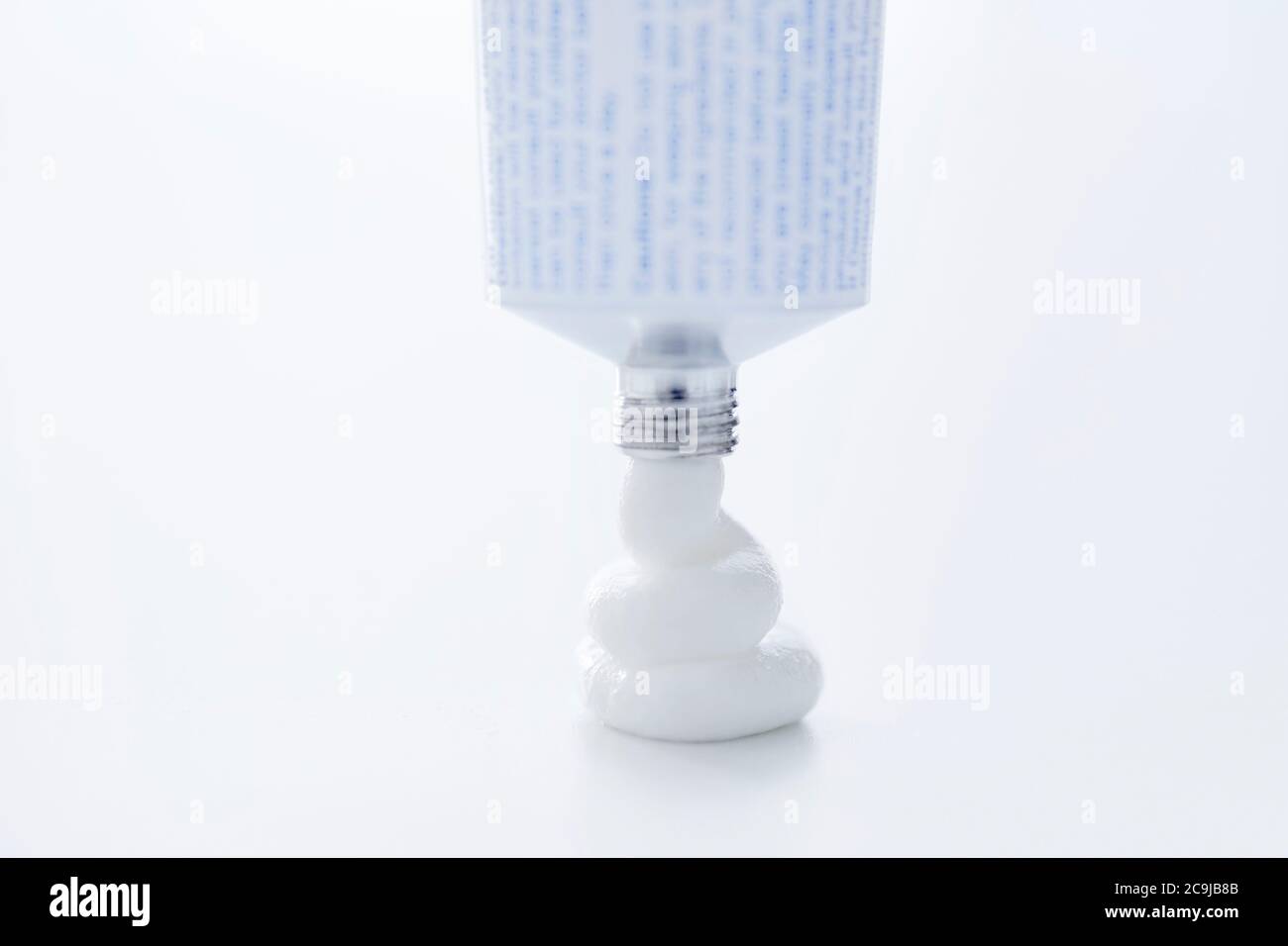 Medical cream coming out of the tube. Stock Photo