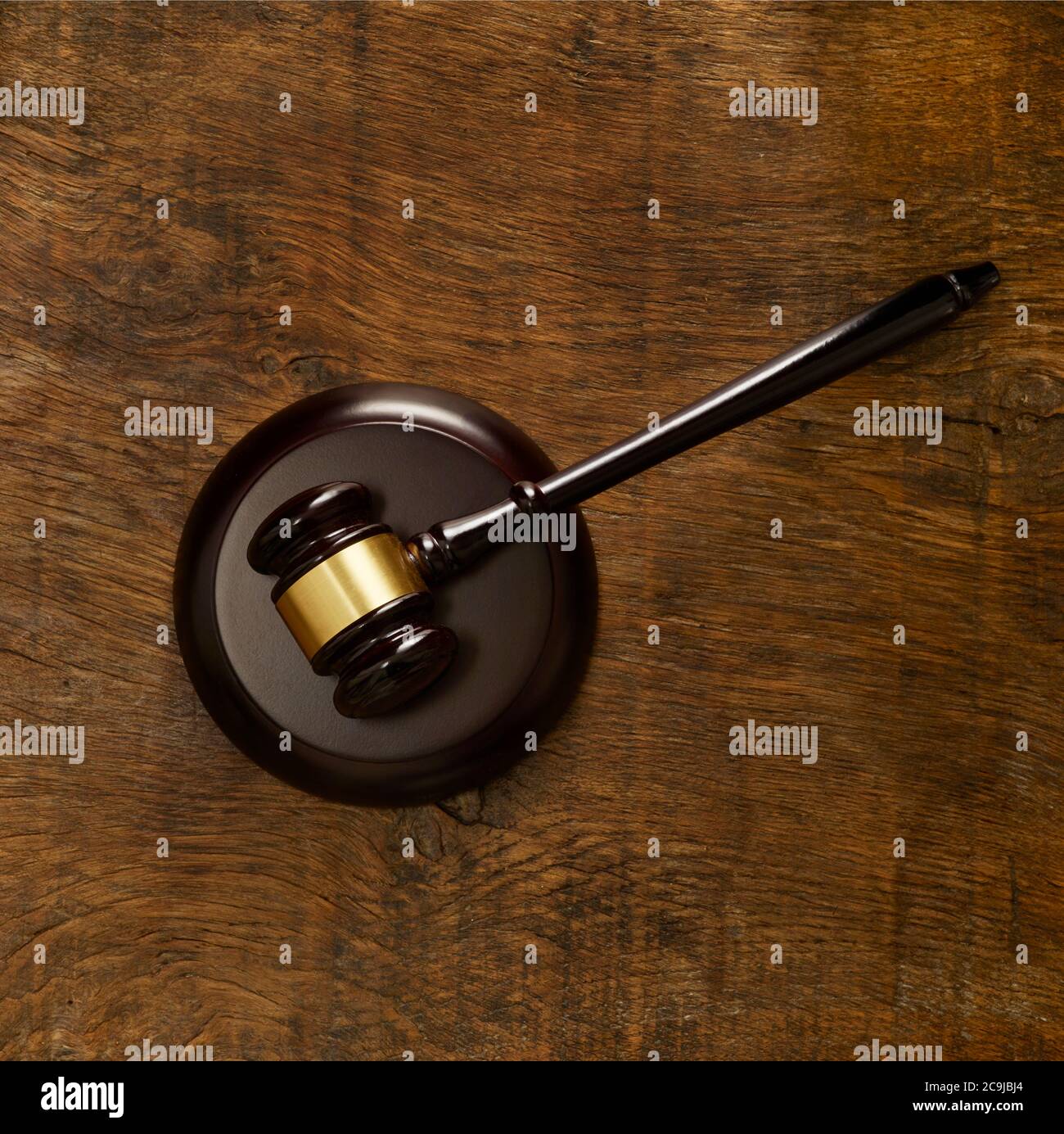 Lawers gavel against wooden background. Stock Photo