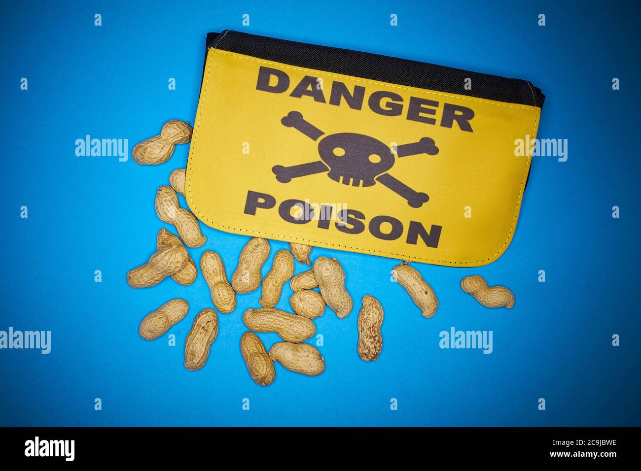 Peanuts and bag with Danger Poison, allergy concept, illustration. Stock Photo