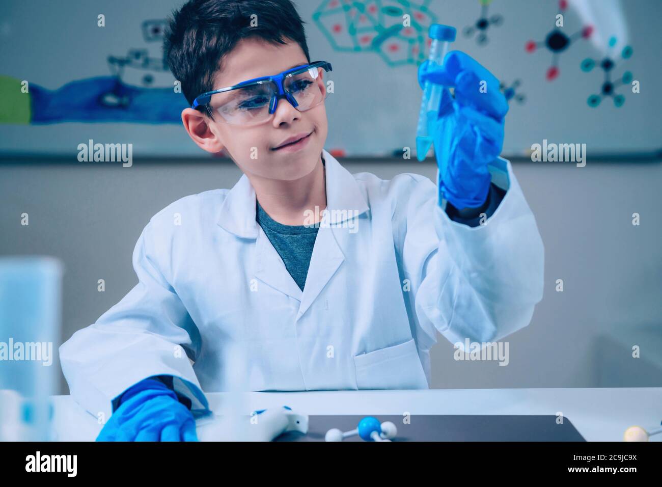 Schoolboy doing chemistry experiment Stock Photo - Alamy