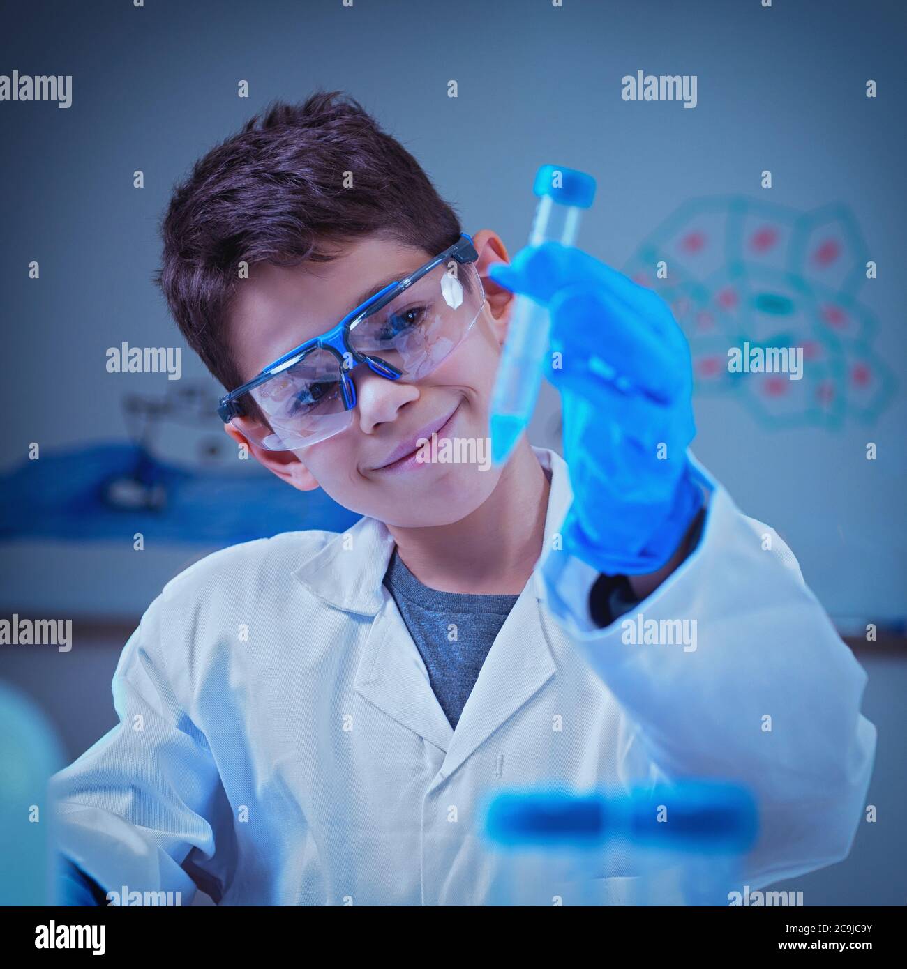 Schoolboy doing chemistry experiment Stock Photo - Alamy