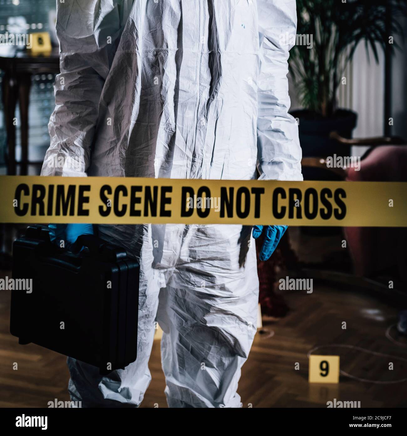 Crime scene. Forensics expert collecting evidence from a crime scene(03)