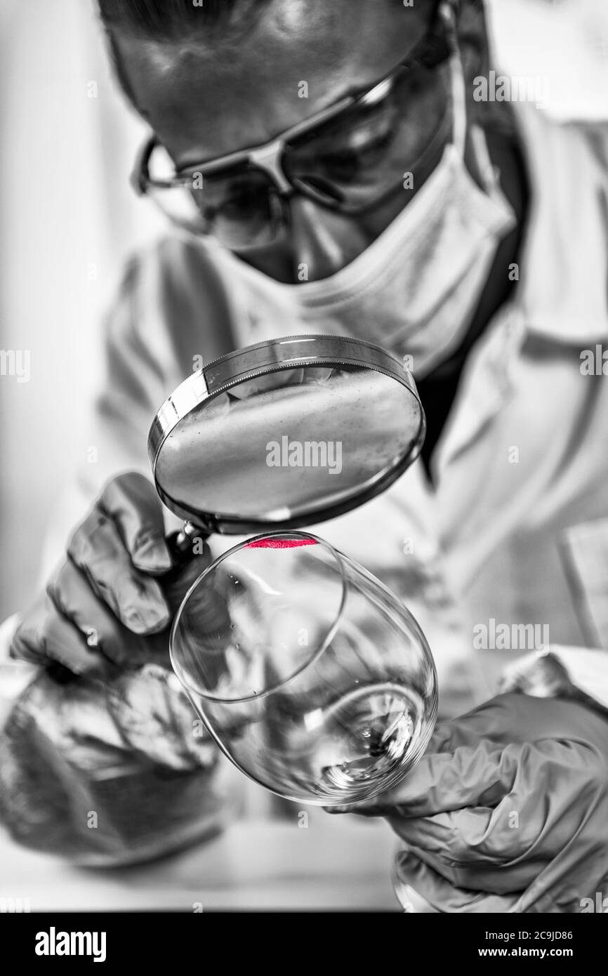 Forensic Evidence examination. Police laboratory analyst examining