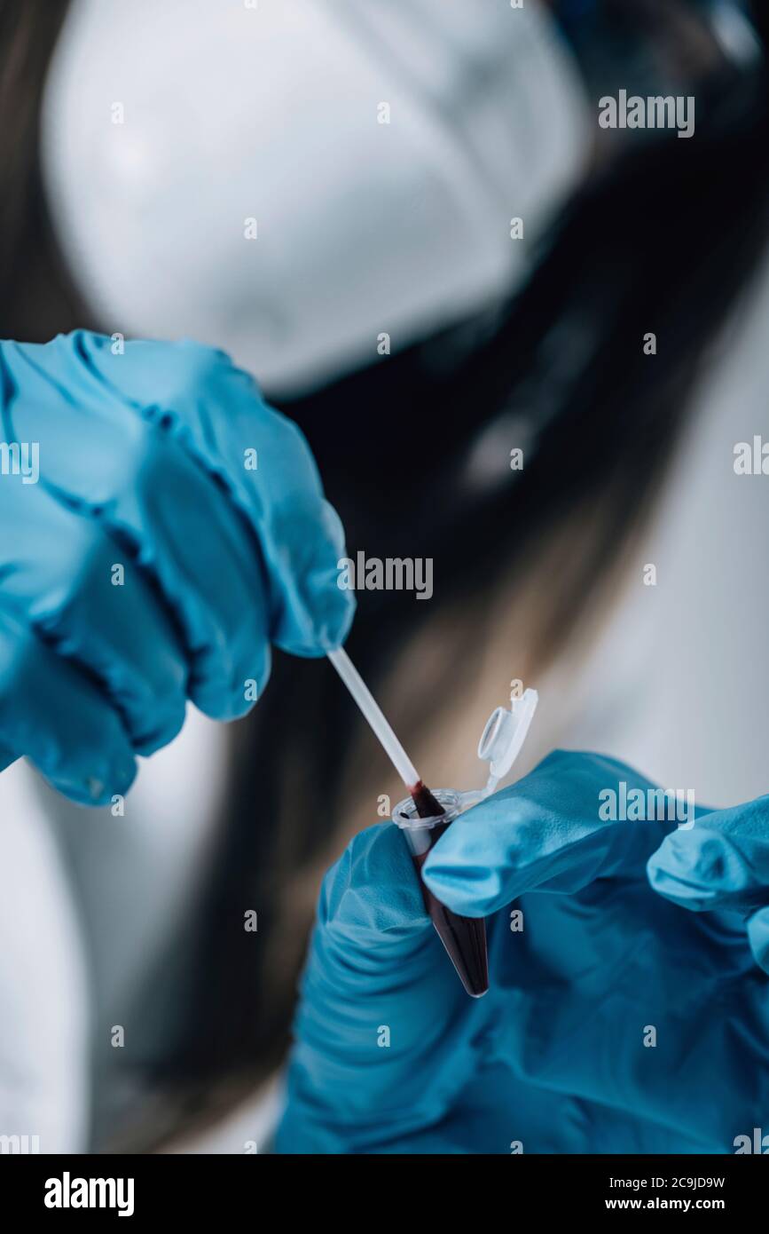 Forensic Science in Lab. Forensic Scientist examining DNA evidence. Stock Photo