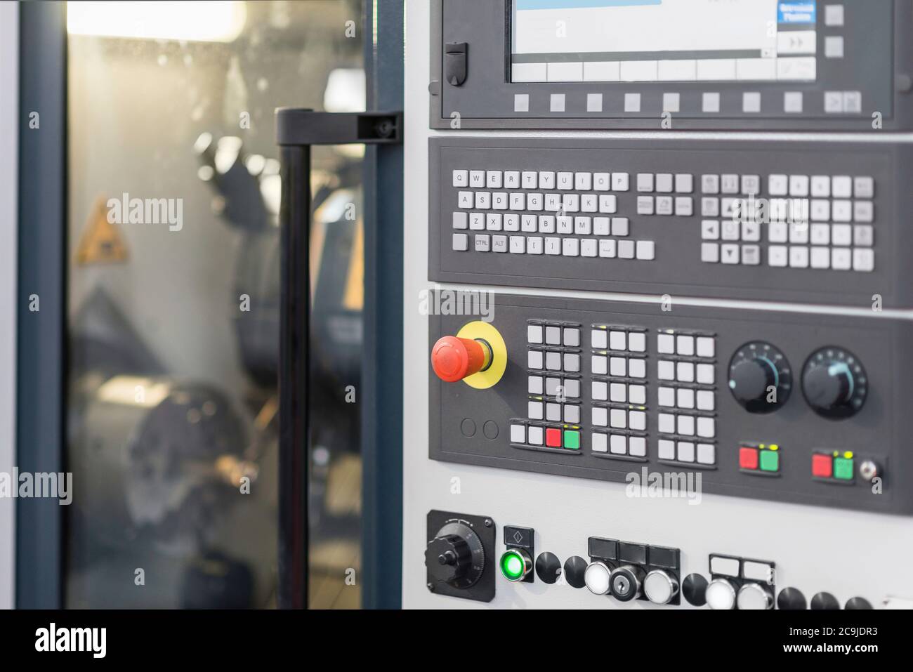 Automated CNC toolroom lathe with control console. Stock Photo
