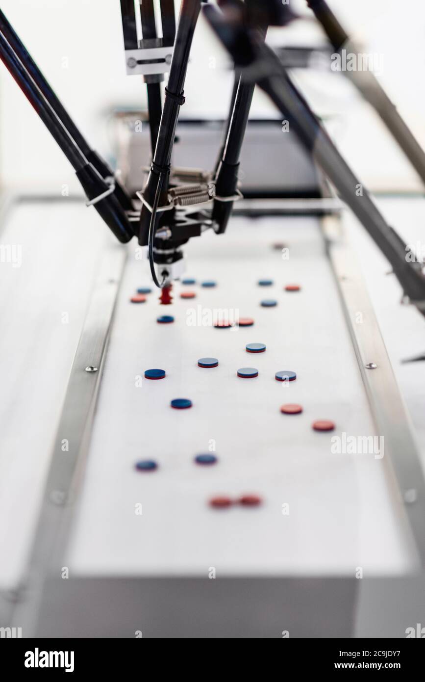 Robotic handling machine for pharmaceutical industry. Robotic arm ...