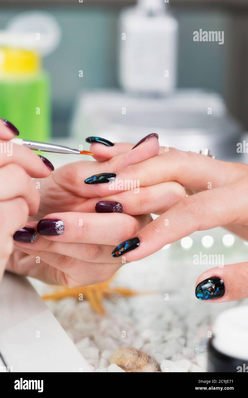 Painting nails hires stock photography and images Alamy