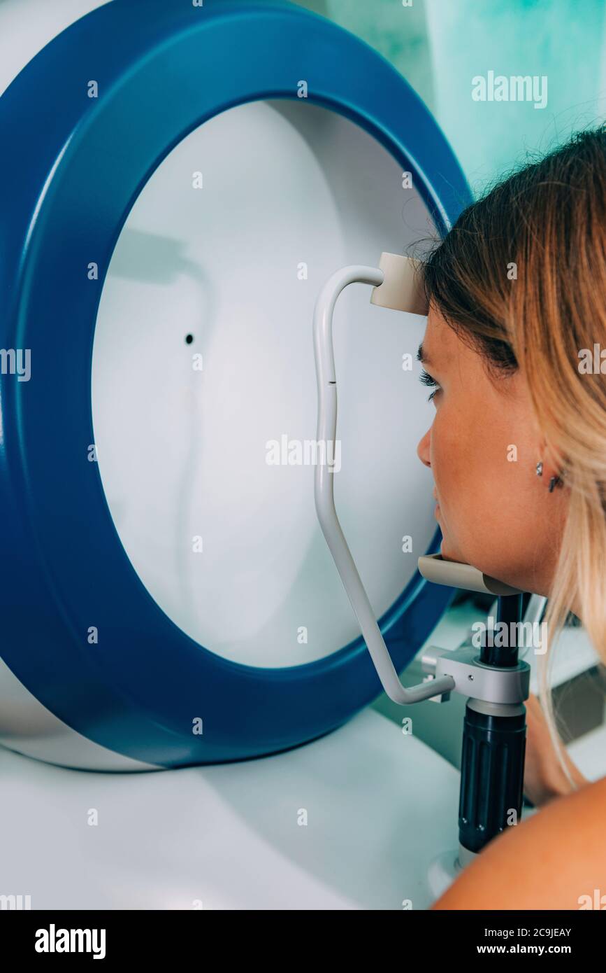 Ophthalmologist examining patient with Ascan ultrasound biometry Stock