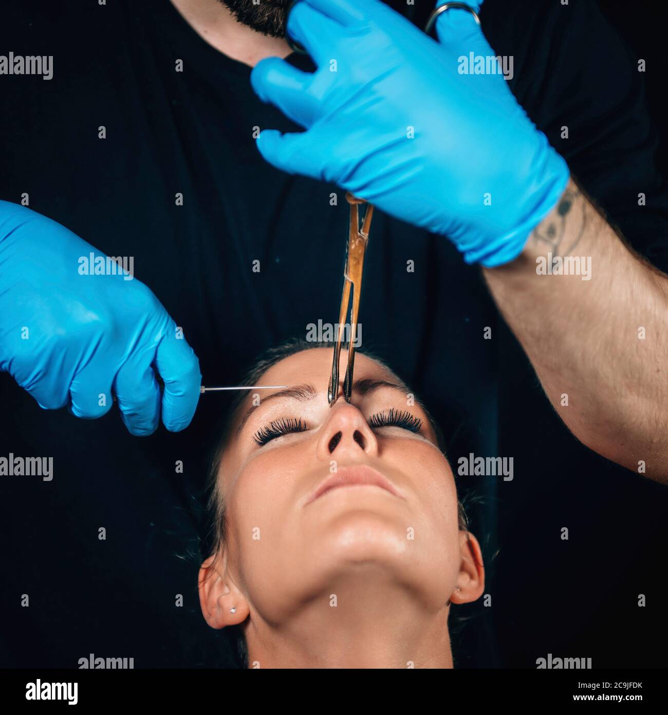 Nose bridge piercing. Stock Photo