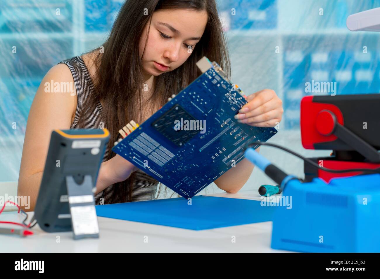 Girl working on electronics project Stock Photo Alamy