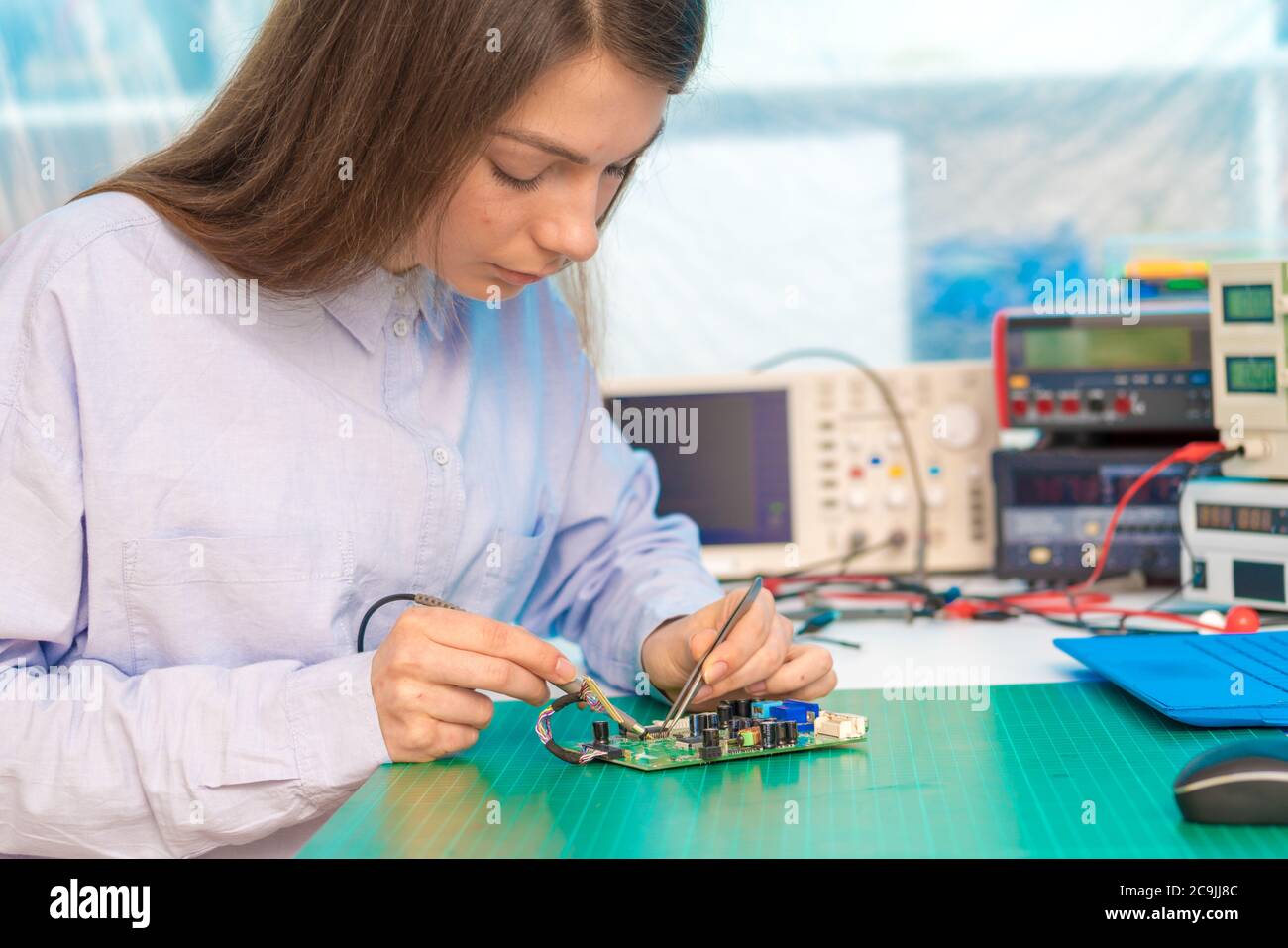 Engineer working on circuit board. Stock Photo