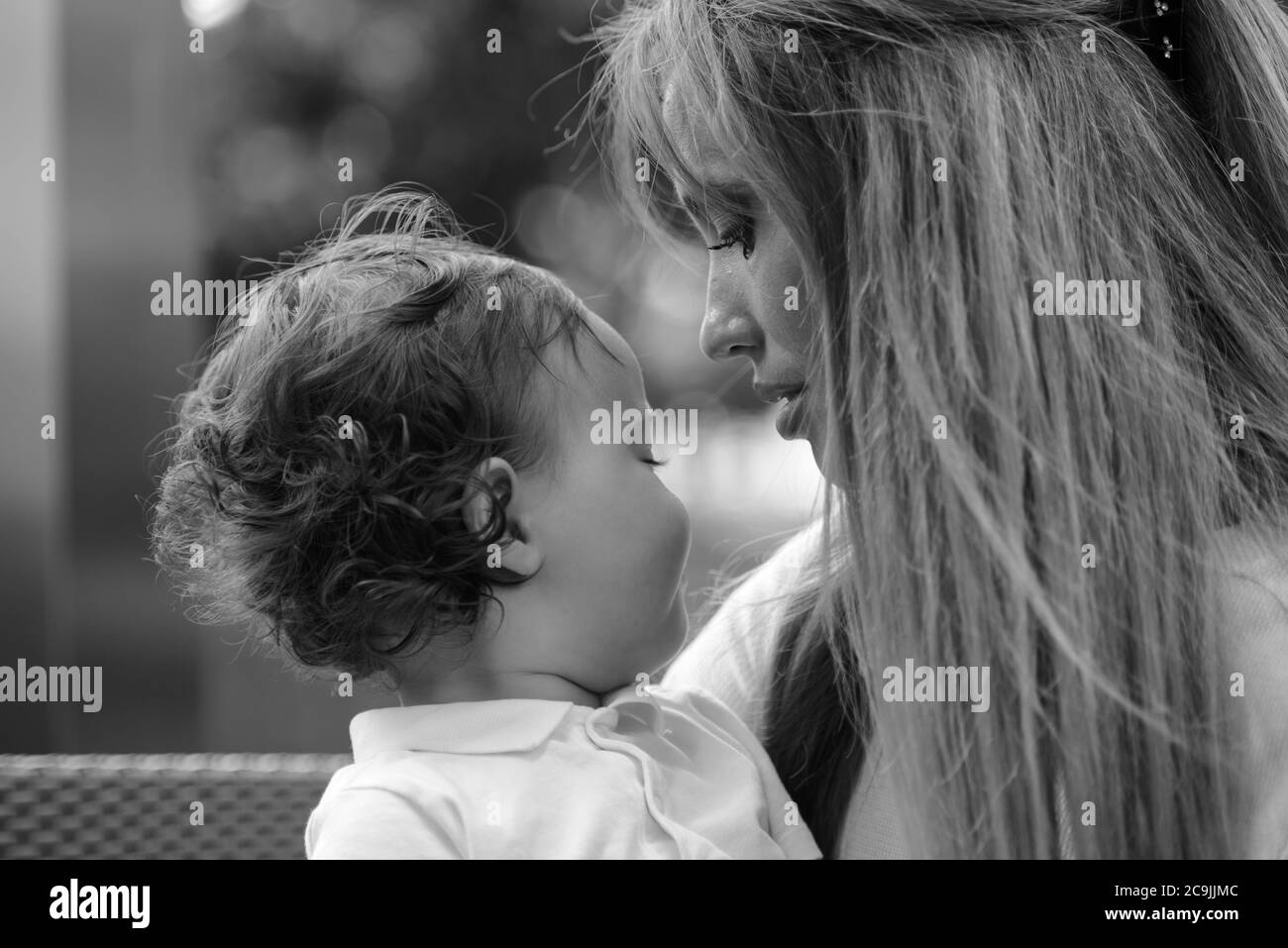Young beautiful blonde mother with adorable baby son together Stock Photo