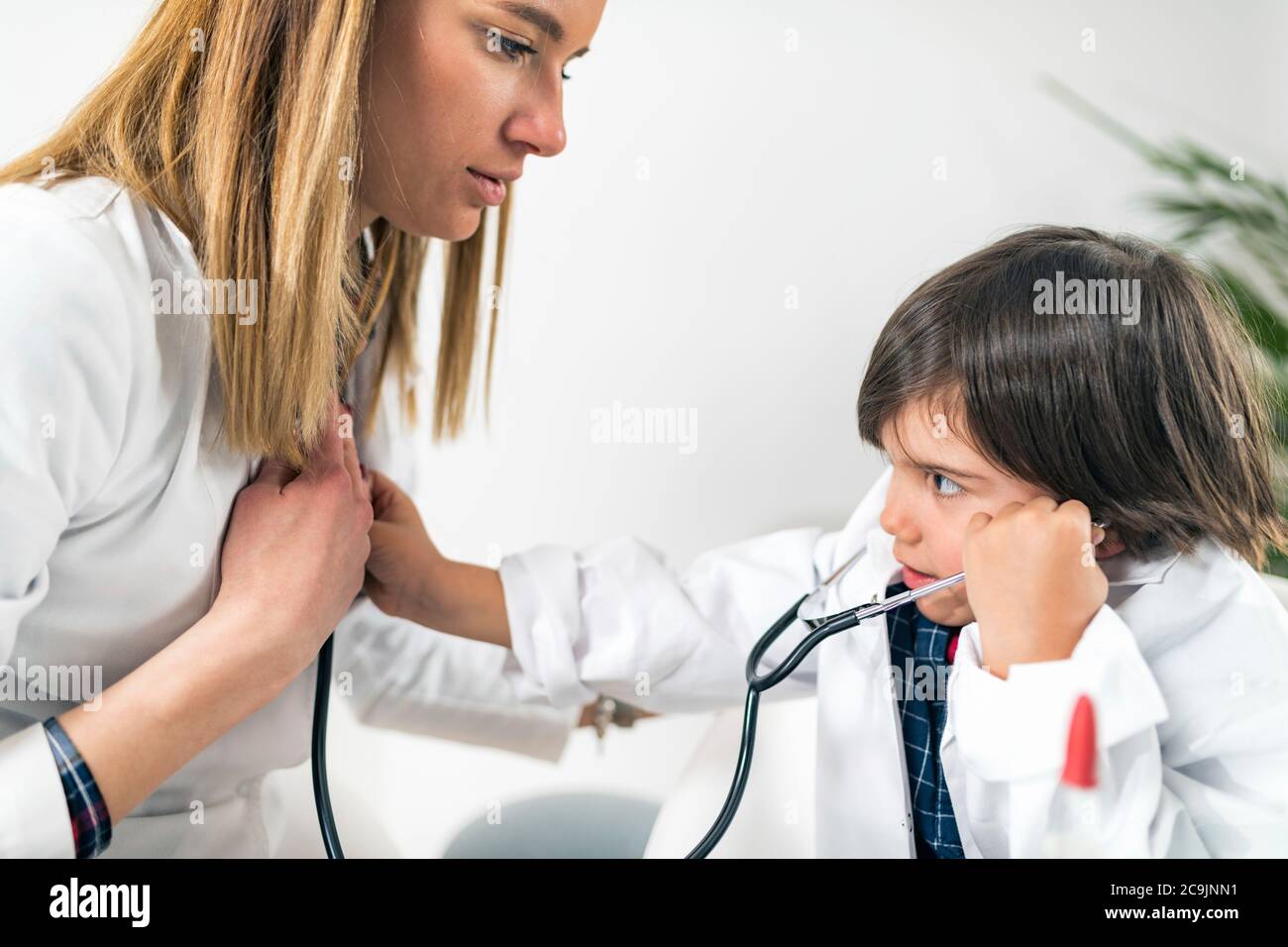 Little boy playing at being a doctor in a paediatrician's office. Stock Photo