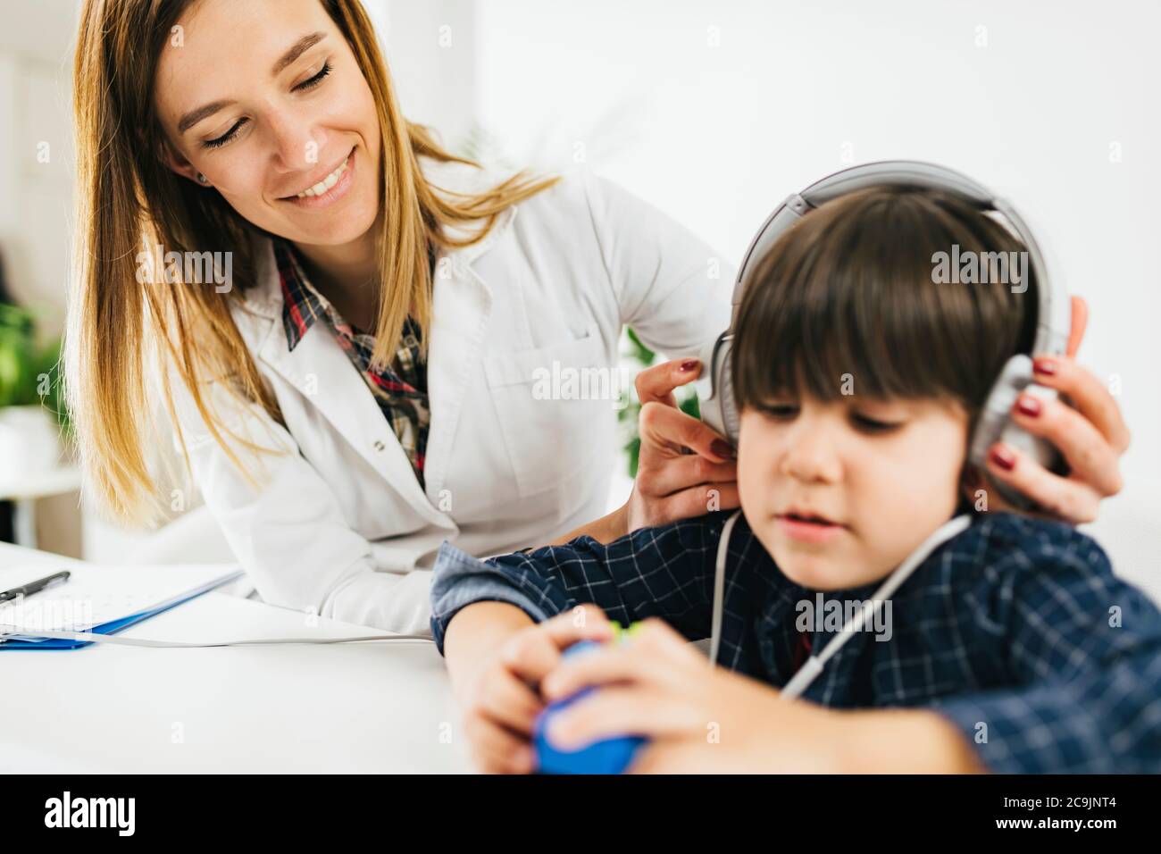 Boy having a hearing test in an audiologist's office Stock Photo Alamy