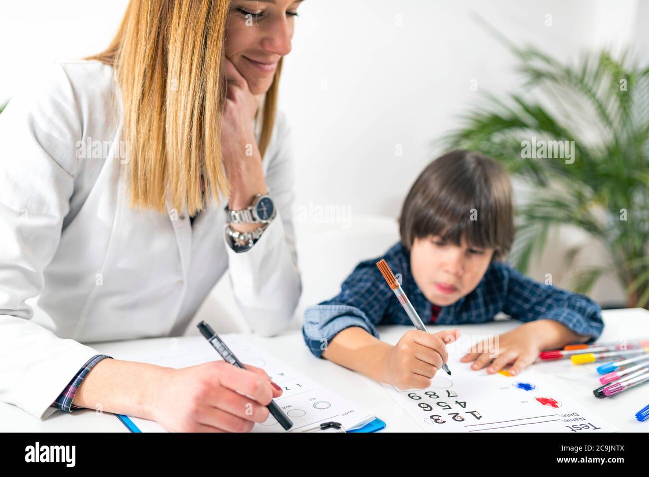 Psychology test for children. Toddler undergoing a logic test with numbers. Stock Photo